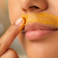 Applying Turmeric Wax on Upper Lip