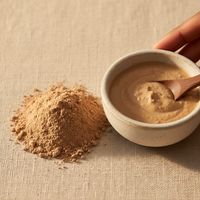 Multani Mitti clay powder in bowl with spoon – product shot
