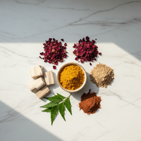 Ayurvedic body ubtan ingredients — haldi, sandalwood, multani mitti, rose petals flatlay